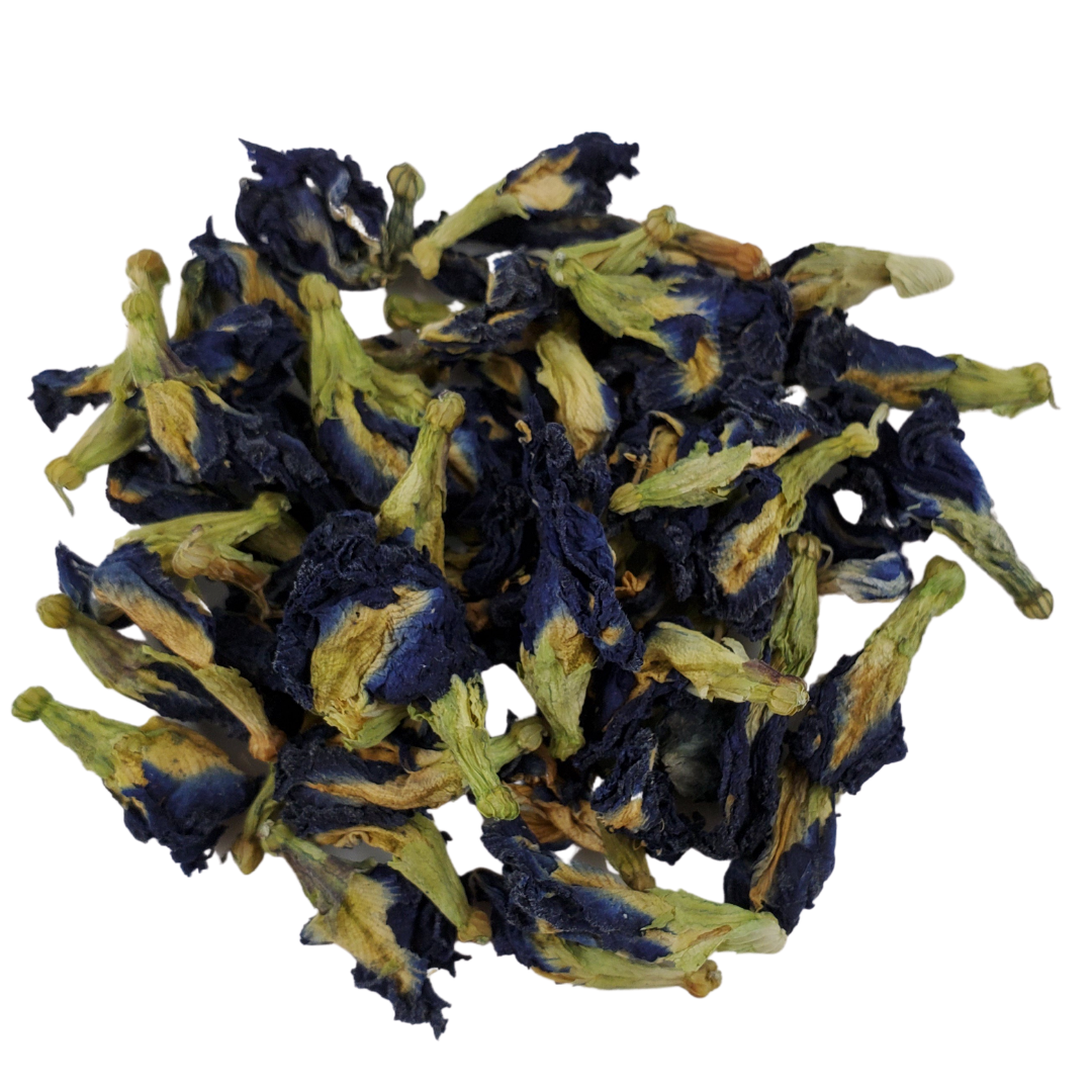 Dried blue pea flowers on a white background