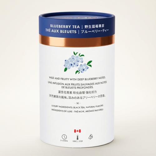 White canister of blueberry tea with blue and gold lid on a beige background