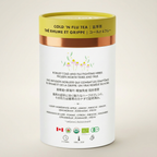 Cold and flu tea packaging with a white label and yellow lid on a beige background