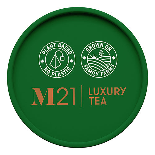 Green lid of M21 Luxury Tea packaging with branding and sustainability claims.