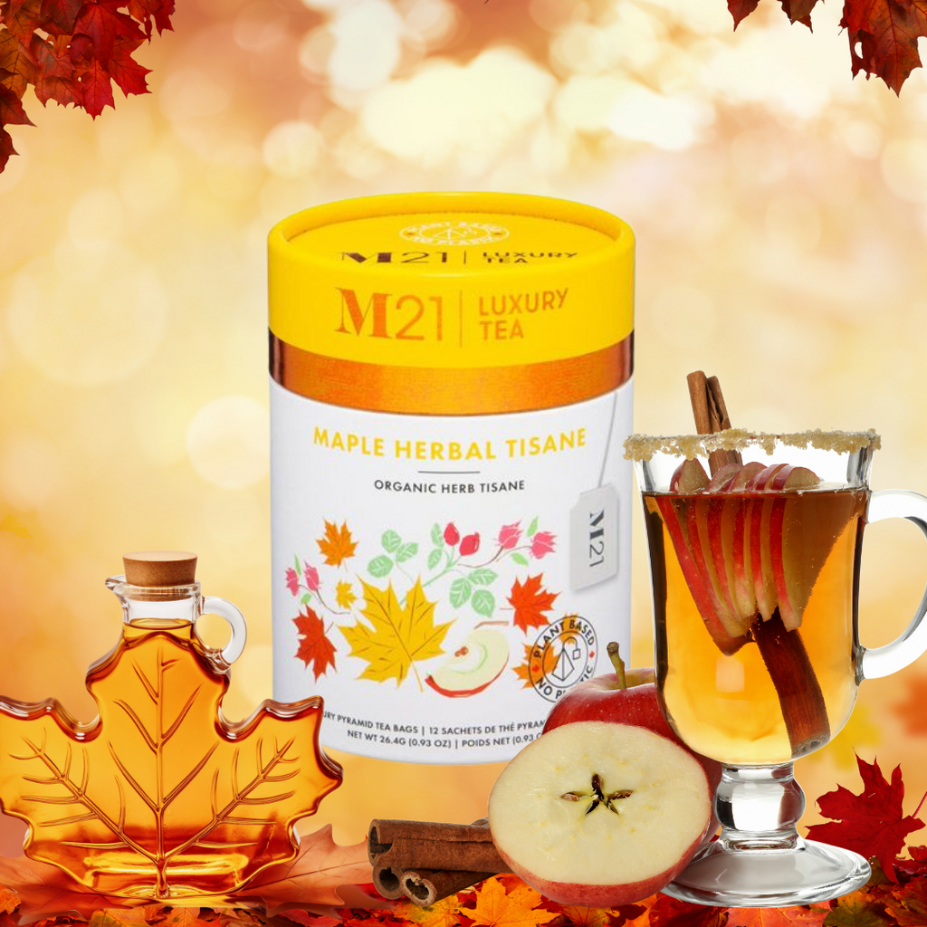 M21 Luxury Tea Maple Herbal Tisane with a glass of tea, maple syrup, and apples on an autumn-themed background.