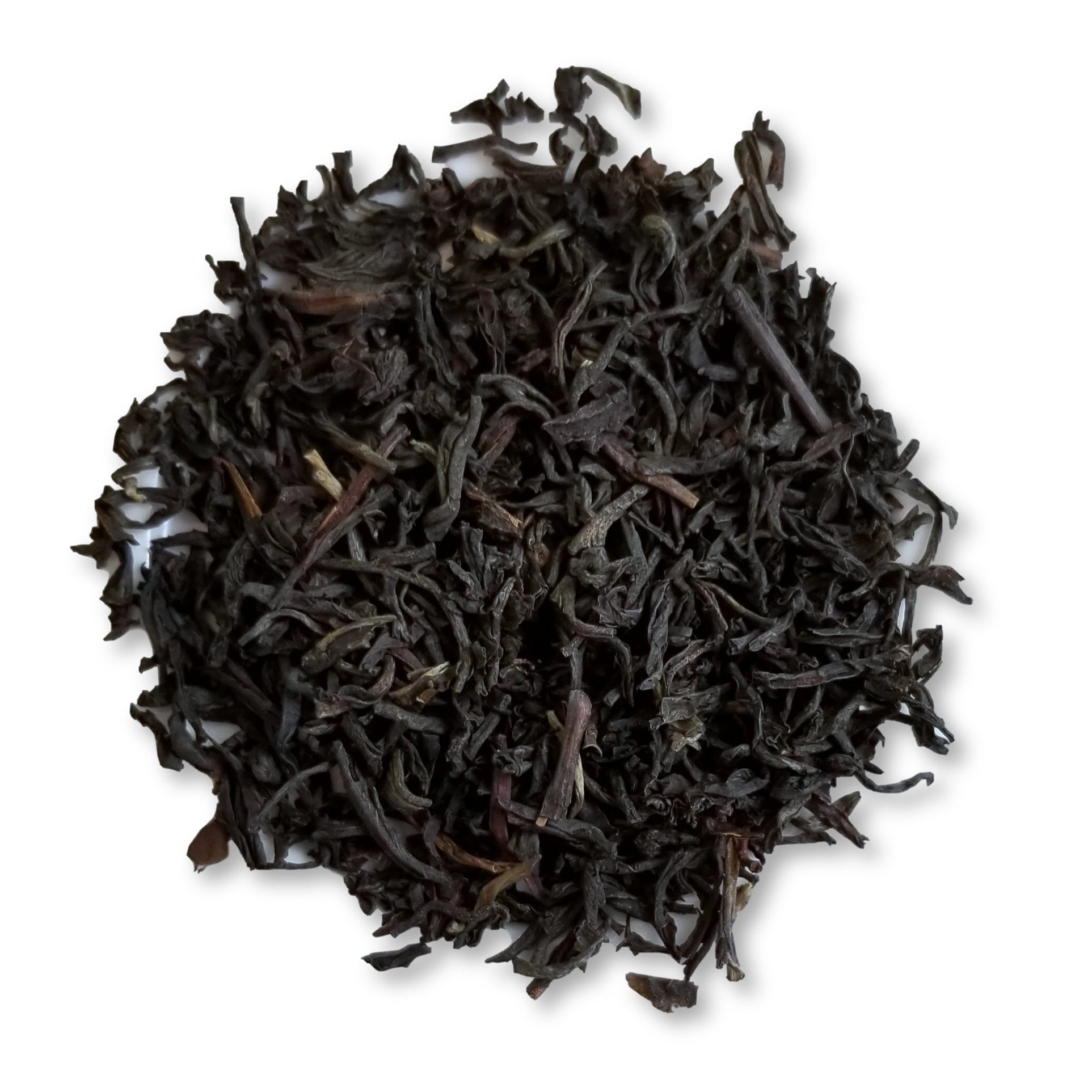 Dry black tea leaves on a white background