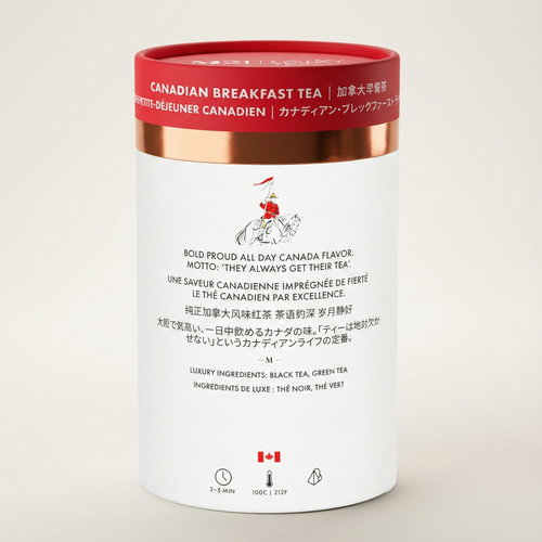 Canadian breakfast tea canister with red and gold lid on a beige background
