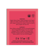 Pink tea bag label with black text on a white background